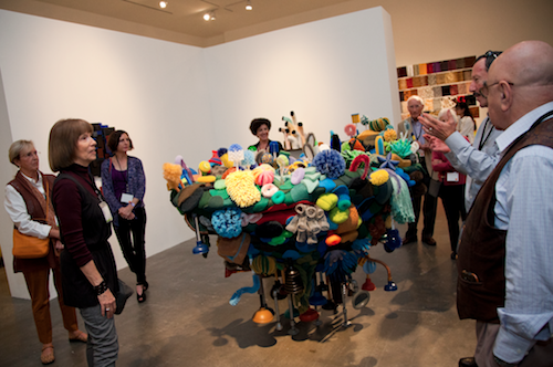 Alum Lynne Aldrich leads a tour of her sculpture exhibit in the Williamson Gallery 