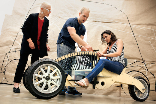 Graduate Transportation Systems and Design student Garrett DeBry (center) and his personal transportation vehicle full-scale prototype. Photo by Stella Kalinina