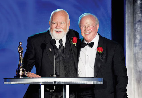 Peter W. Anderson (BFA 67), left, accepting his Oscar at the Academy's Technical Achievement Awards with Douglas Trumbull. (Credit: Michael Yada/©A.M.P.A.S.)