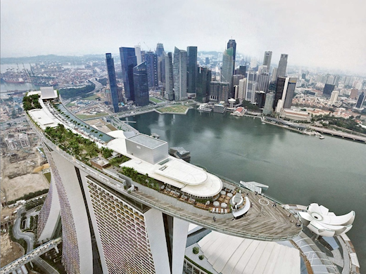 An aerial view of Singapore's skyline, with the Marina Bay Sands hotel in the foreground.