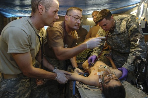 Army medics treat a victim of a bombing in Tikrit, Iraq in 2006. Photo: Christopher Stoltz