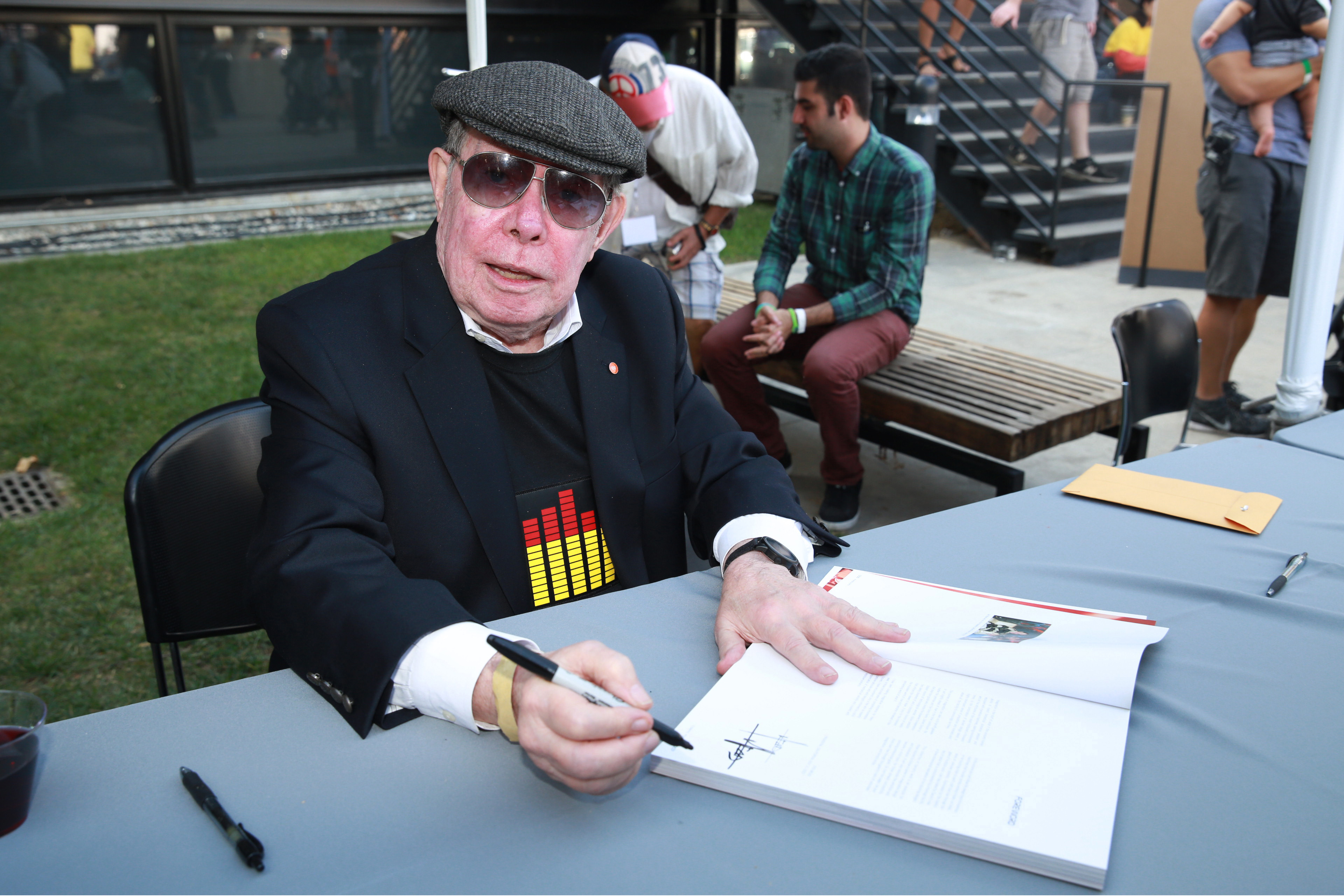 Syd Mead signing books at Car Classic 2014. Photo: Alexandra Wyman